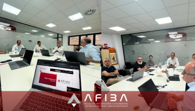 Group of professionals around a white conference table with laptops in a bright office; a red ALFIBA banner runs across the bottom of the image.
